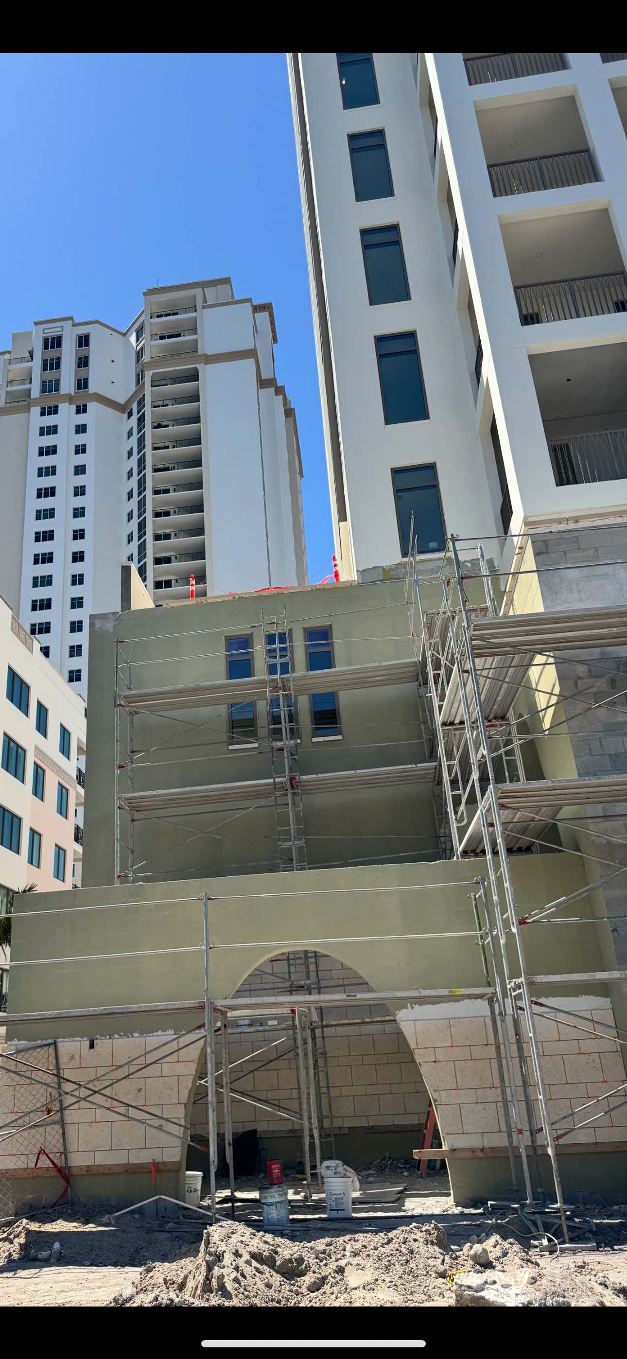 Before waterproofing - raw CMU construction site with scaffolding